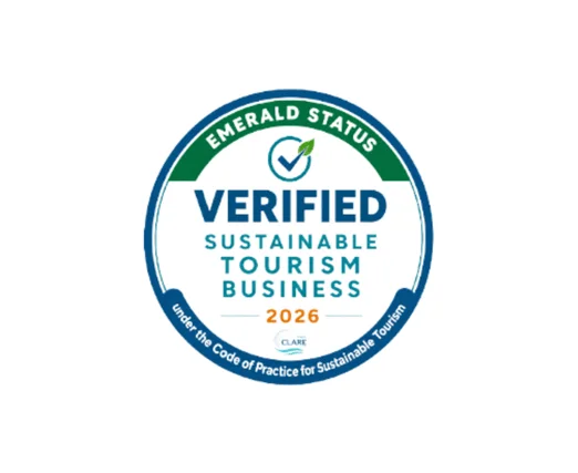 An image of a badge recognising tourism businesses that have successfully adopted the Code of Practice for Sustainable Tourism for those who have achieved Emerald Status.